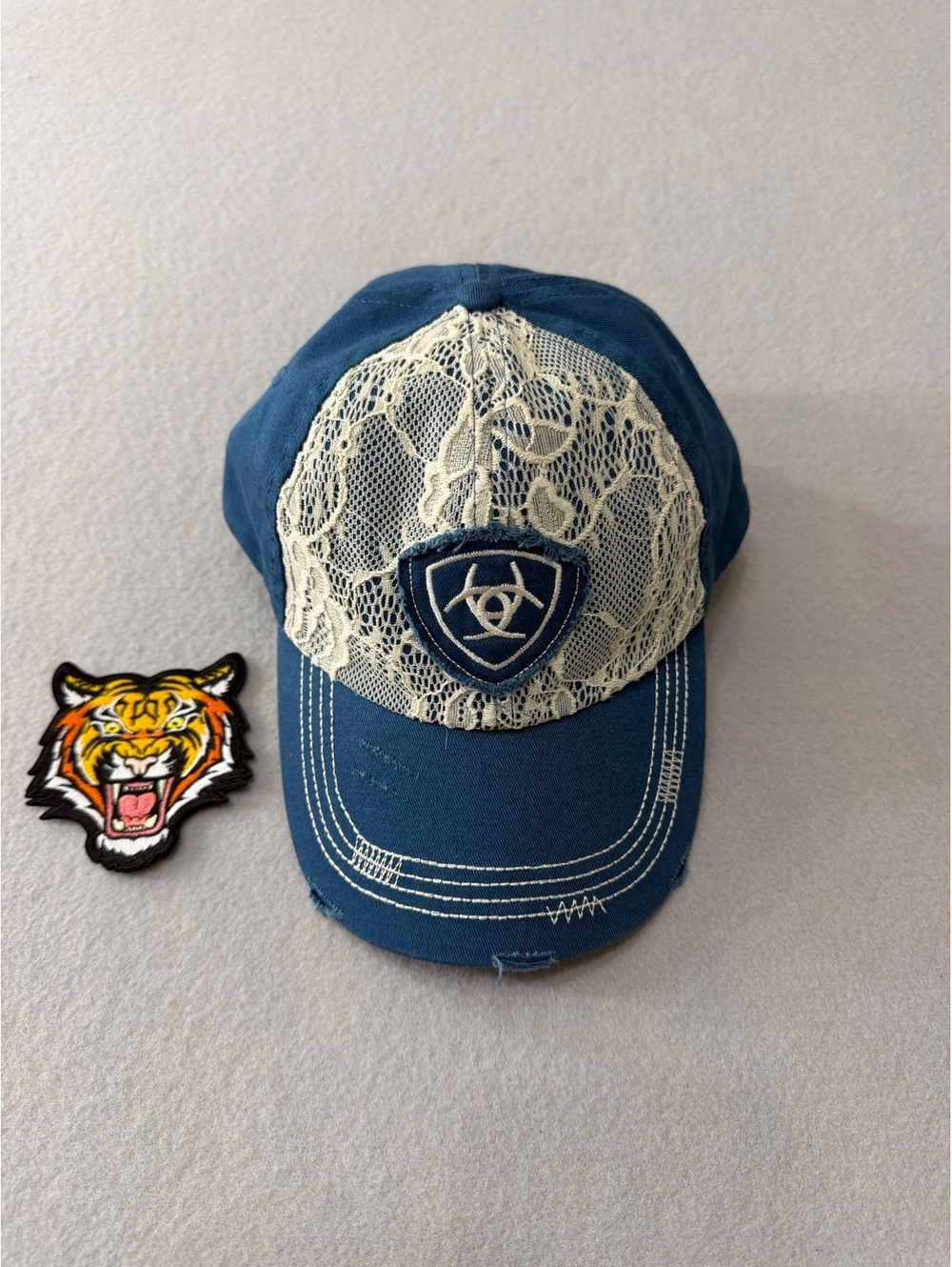 276/519 Ariat Navy Lace Mesh Trucker Hat Western Shield Logo Snapback